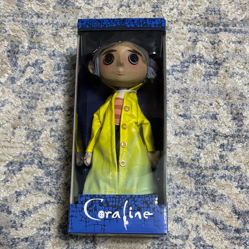 Coraline Yellow Raincoat collectible, brand new